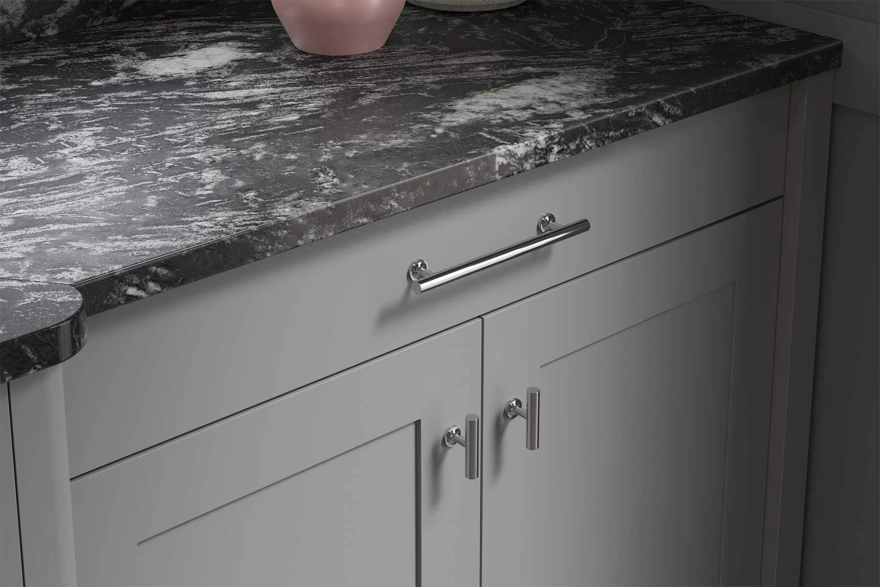 Dove grey Shaker style kitchen cabinets with simple chrome handles and black marble worktop