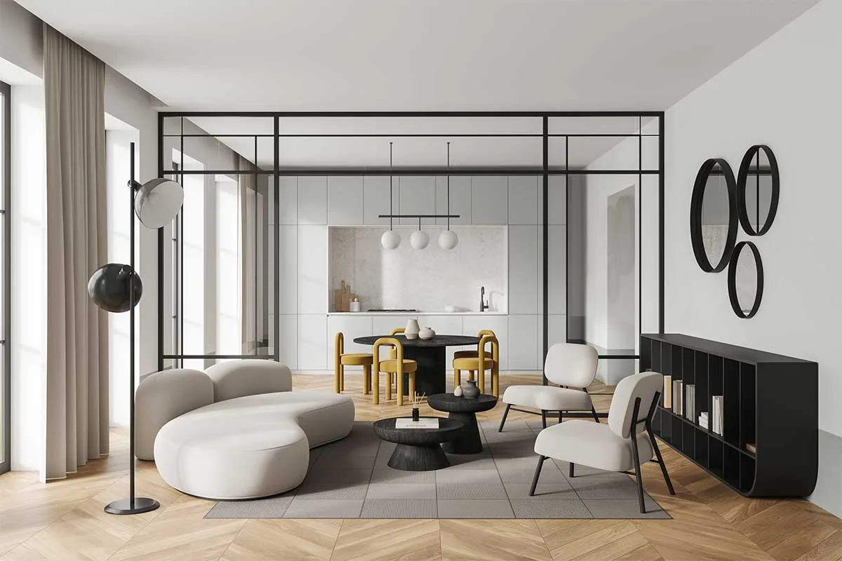 A broken plan kitchen with industrial style glass room divider between the kitchen and lounge area