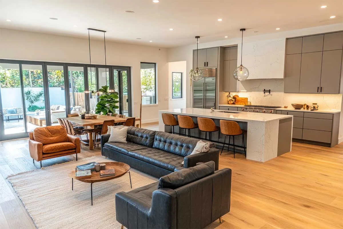 Large open plan kitchens like this have defined cooking and entertaining zones