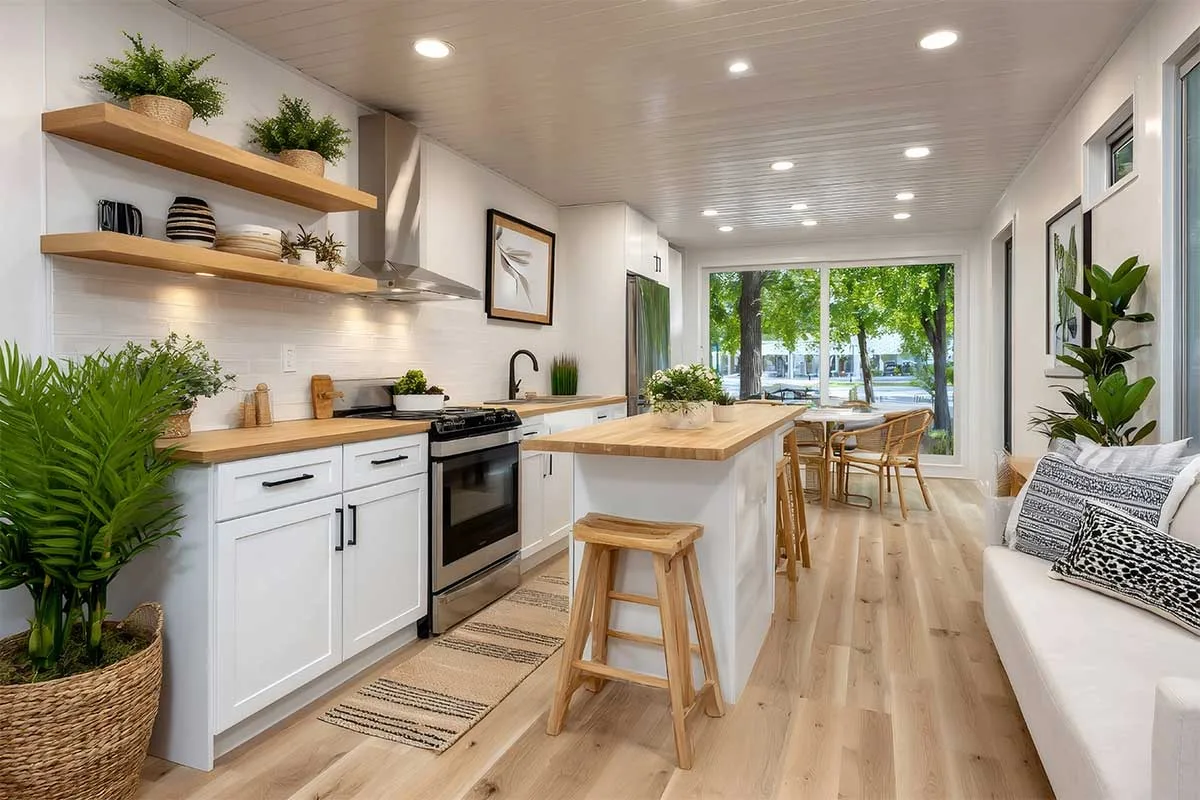 Farmhouse style galley kitchen uses lots of ambient lighting to create a bright and welcoming space