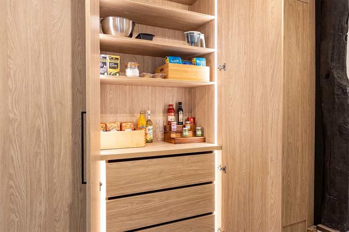 Kitchen larder cupboard with integrated LED in-cabinet lighting