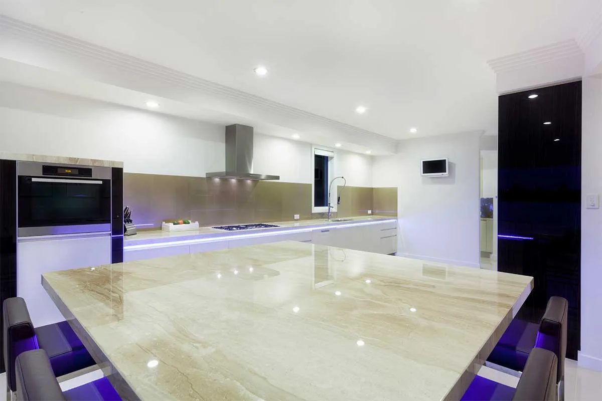 Large and bright modern kitchen with carefully placed recessed downlights