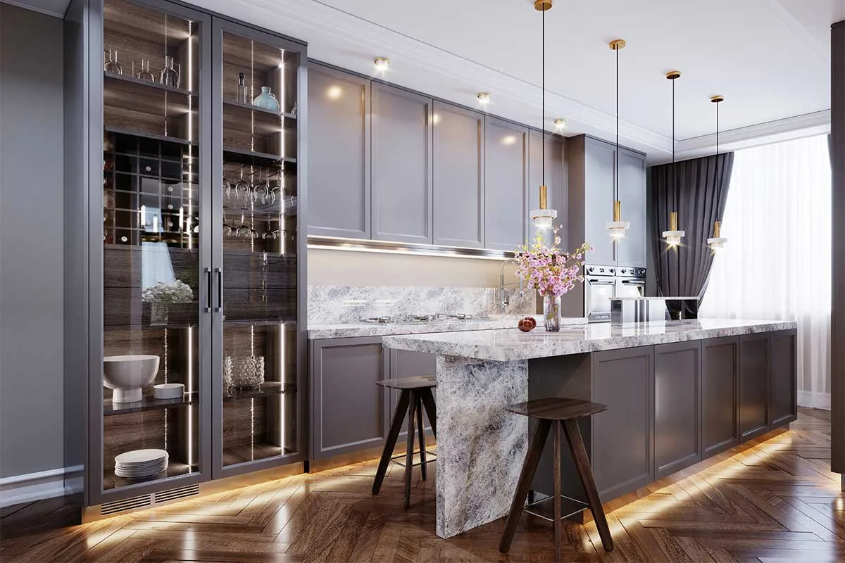 This modern kitchen features led plinth lighting which is decorative and practical