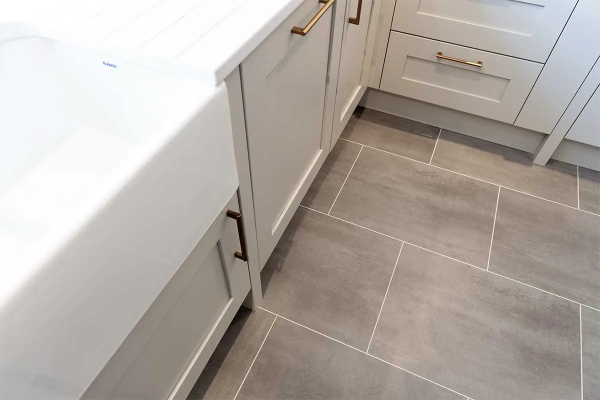 Graphite stone effect Amtico luxury vinyl kitchen flooring installed throughout the showroom at Claremont Kitchens in Midhurst